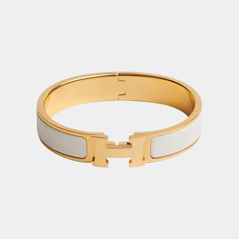 Mother of Pearl H bangle bracelet in 18k gold finish, Hermes inspired luxury jewellery with shimmering shell inlay.