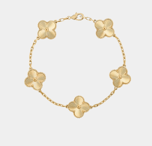 Stunning 18k gold clover charm bracelet, the perfect luxury gift for her inspired by timeless jewellery designs.